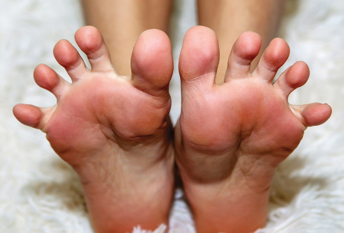 493ss_thinkstock_rf_woman_stretching_feet